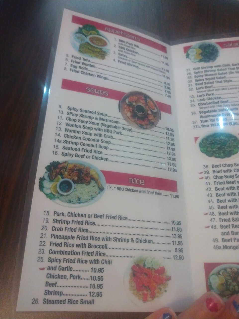 Thai menu featuring salads, noodles, and seafood.